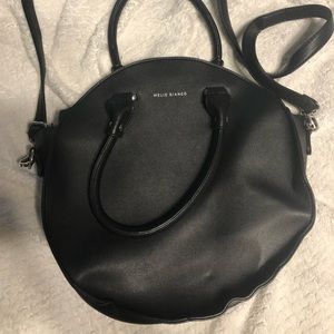 Round vegan leather handbag by Melie Bianco
